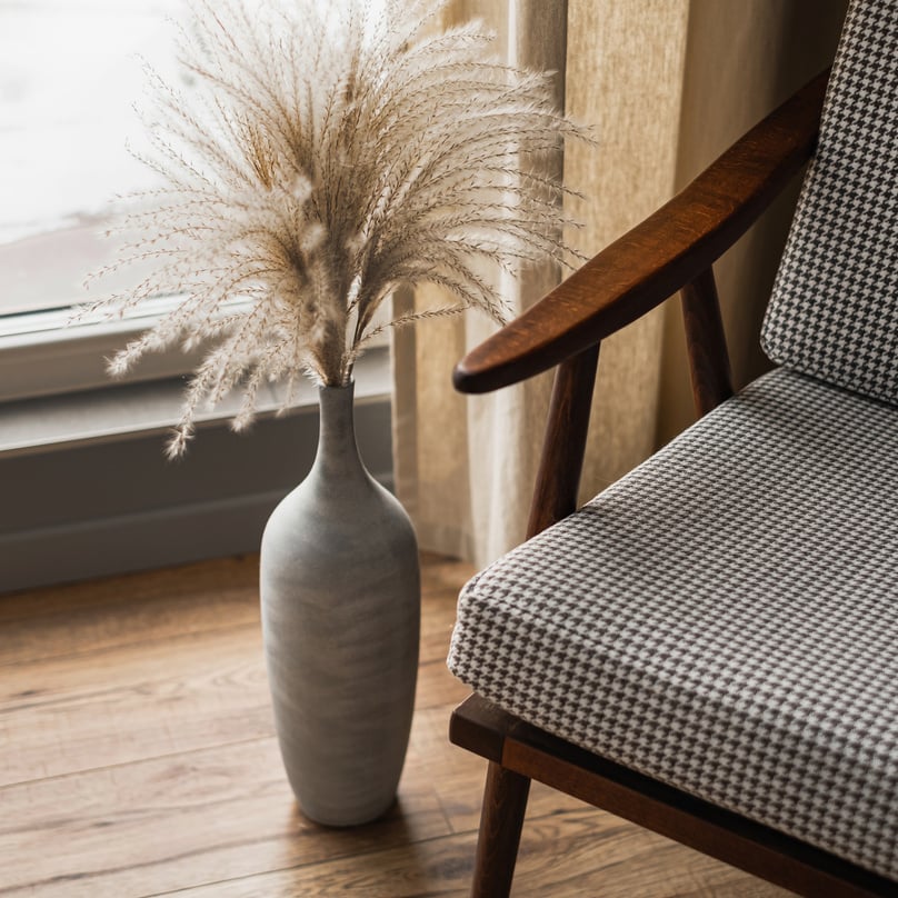 Vase of Pampas Grass and Chair in a Room